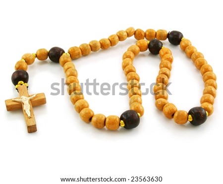 Wooden rosary and cross isolated on a white background