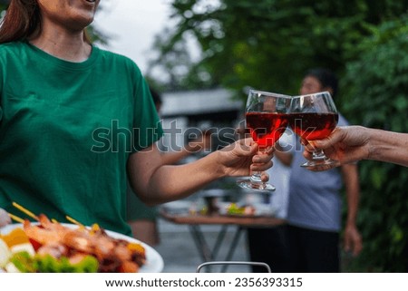Happy family having fun outdoor. Group of family having backyard dinner party bbq together.cheers barbecue party