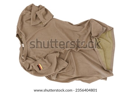 Crumpled Brown German Armed Forces T-Shirt On White Background With German Flag Patch, Bundeswehr T-Shirt, German Army T-Shirt, Shirt German Army, Military Shirt, Military T-Shirt, Camouflage Shirt Royalty-Free Stock Photo #2356404801