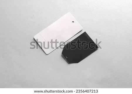Black and white price tags on dark gray background