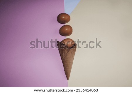 Ice cream cone with eggs on colored background. Minimal easter concept, Flat Lay. Perfect for background.