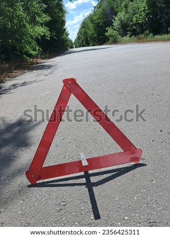 Warning triangle on the road, accident