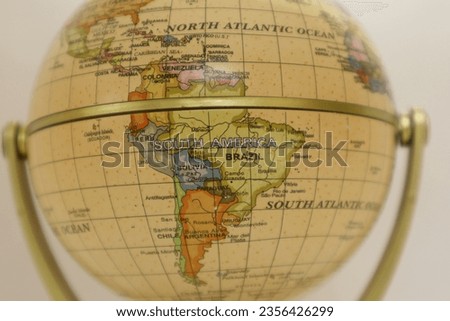South America on Globe. South America Map on a Vintage Globe. South America on Atlas World Map. Part of a globe with a map of South America. globe world map. Royalty-Free Stock Photo #2356426299