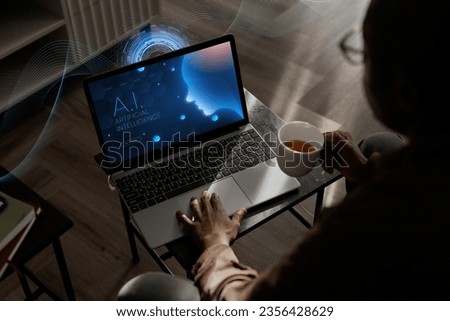 People generating images using artificial intelligence on laptop Royalty-Free Stock Photo #2356428629