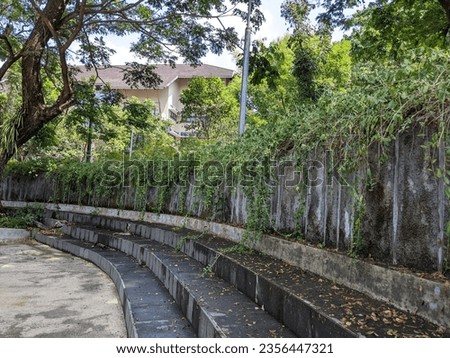 walls, seats and lush plants at wisdom park, gadjah mada university, yogyakarta, 3 september 2023 Royalty-Free Stock Photo #2356447321