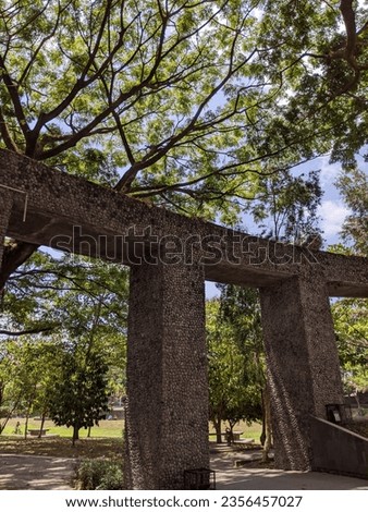 garden gate wall with a beautiful view of a forest of trees in the Wisdom Park area of Gadjah Mada University, Yogyakarta September 3, 2023 Royalty-Free Stock Photo #2356457027