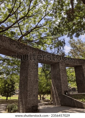 garden gate wall with a beautiful view of a forest of trees in the Wisdom Park area of Gadjah Mada University, Yogyakarta September 3, 2023 Royalty-Free Stock Photo #2356457029