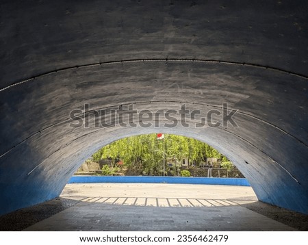 view of the red and white Indonesian flag flying from inside the Iconic tunnel at Wisdom Park, Gadjah Mada University, Yogyakarta, 3 September 2023 Royalty-Free Stock Photo #2356462479