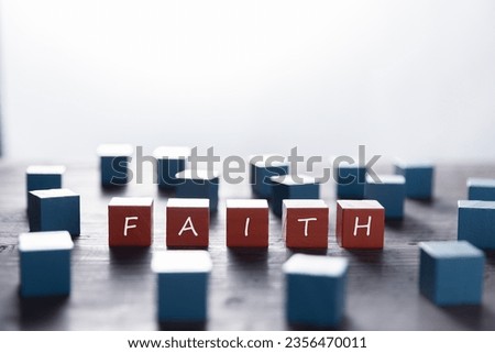 Faith symbol. Turned wooden cube with words Faith. Beautiful white background. Business and Faith concept. Copy space