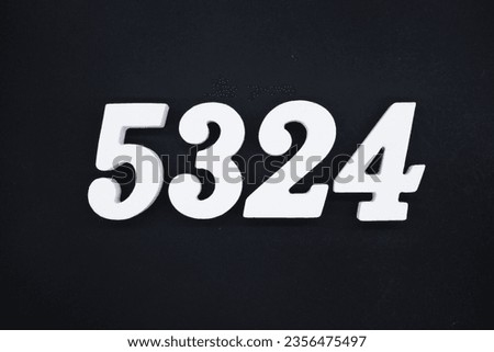 Black for the background. The number 5324 is made of white painted wood.