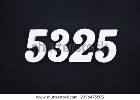 Black for the background. The number 5325 is made of white painted wood.