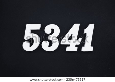 Black for the background. The number 5341 is made of white painted wood.