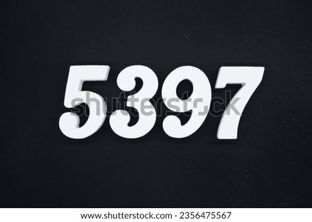 Black for the background. The number 5397 is made of white painted wood.