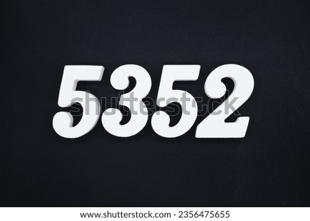 Black for the background. The number 5352 is made of white painted wood.