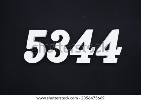 Black for the background. The number 5344 is made of white painted wood.