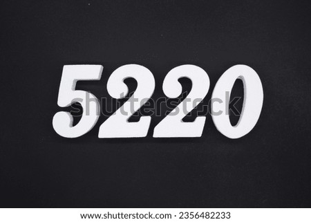 Black for the background. The number 5220 is made of white painted wood.