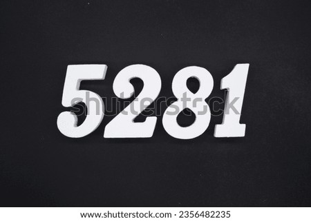 Black for the background. The number 5281 is made of white painted wood.