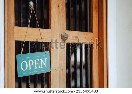open sign hanging outside a restaurant, store, office or other