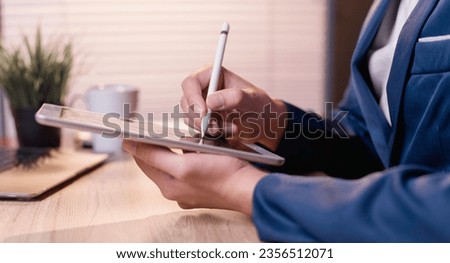 office a businessman focus on their work. With pens, notebooks, and notepads in hand, they diligently write, plan, and manage their corporate responsibilities at their desks.