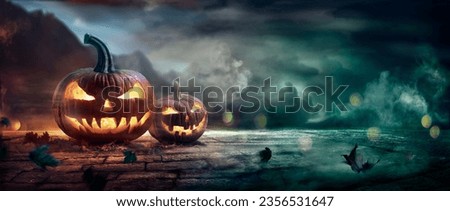 Halloween Pumpkins In A Spooky Night With Abstract Defocused Light And Smoke Effects