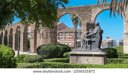 Ruins of the ancient Roman aqueduct and statue to the Marquis de la Constancia in the town of Plasencia, Spain Royalty-Free Stock Photo #2356531871