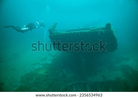 Divers exploring the shipwreck, Dolphin in the Straits of Mackinac. Royalty-Free Stock Photo #2356534963