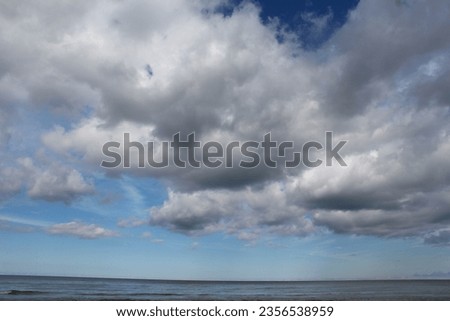 beautiful cumulus cloud over ocean weather and travel background