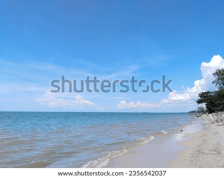 Bright blue sky and beach sand