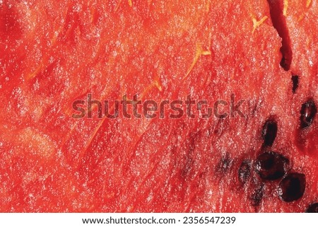 Abstract texture of watermelon pink with seeds and crack close up