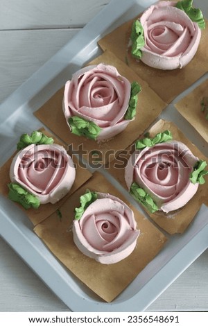 Homemade marshmallows. Zephyr flowers. On the tray. On white boards. Top view. Royalty-Free Stock Photo #2356548691