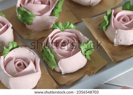 Homemade marshmallows. Zephyr flowers. On the tray. On white boards. Close-up. Royalty-Free Stock Photo #2356548703