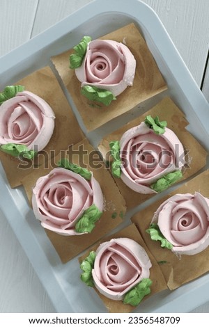 Homemade marshmallows. Zephyr flowers. On the tray. On white boards. Top view. Royalty-Free Stock Photo #2356548709