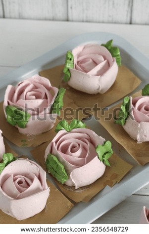 Zephyr flowers. Homemade marshmallows. On the tray. On white boards. Royalty-Free Stock Photo #2356548729