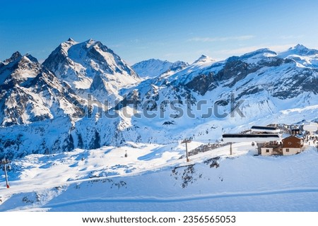Ski resort in winter Alps mountains, France. View of ski slopes and ski lift. Meribel, France. Winter landscape Royalty-Free Stock Photo #2356565053