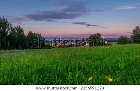 Color morning in Braunegg village over Danube river in summer mountains