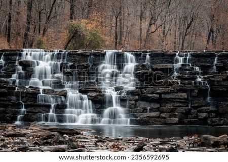 Long Exposure Devil's Den Waterfall in Autumn. Royalty-Free Stock Photo #2356592695