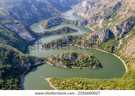 Aerial view to viewpoint Vidikovac Molitva, with curved meanders in canyon of Uvac river, Serbia Royalty-Free Stock Photo #2356600027