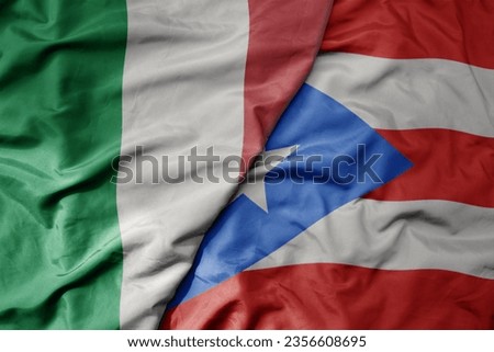 big waving national colorful flag of italy and national flag of puerto rico . macro