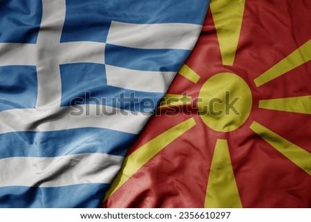 big waving national colorful flag of greece and national flag of macedonia . macro