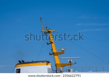 chimney and mast of passenger craft. blue sky background.