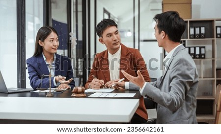 Legal consultation, asian lawyers team meeting post-contract, contract finalization, lawyers discussing agreements, contract review session, agreement assessment, legal experts in conversation
