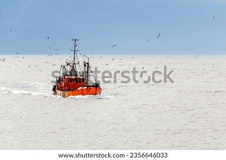 Trawler fishing vessel, with a carrying capacity of 80 t DWT, returning to the Port of Mar del Plata, Argentina. Royalty-Free Stock Photo #2356646033