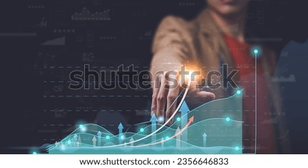 Businessman showing business growth and success graph ,concept of progress in development, financial efficiency and investment with business strategy for goals and opportunities in the industry future Royalty-Free Stock Photo #2356646833