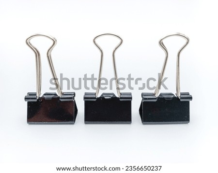 Three Standing Binder Clips Isolated On White Background