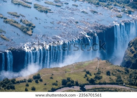 Telephoto shot of the immense Victoria falls, as seen from the air.