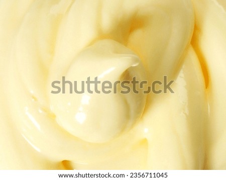 Mayonnaise or mayo is a thick, cold, and creamy sauce commonly used on sandwiches, hamburgers, salads, and fried food. An emulsion of oil, egg yolk, and an acid, either vinegar or lemon juice. Royalty-Free Stock Photo #2356711045