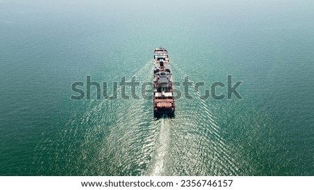 cargo container ship sailing full speed in sea to import export goods and distributing products to dealer and consumers worldwide, by container ship Transport, business logistic delivery service, aeri