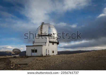 Indian Astronomical Centre in Hanle stands tall against a backdrop of a vivid blue sky adorned with fluffy white clouds