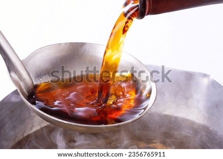 Pouring traditional Japanese soup stock