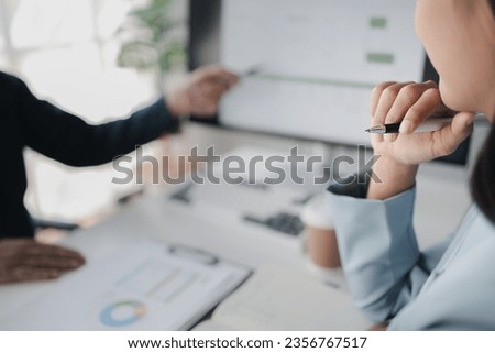 Two people looking at datasheets of marketing and sales results, analysis of business results jointly between executives, department heads and employees to brainstorm company sales management. Royalty-Free Stock Photo #2356767517